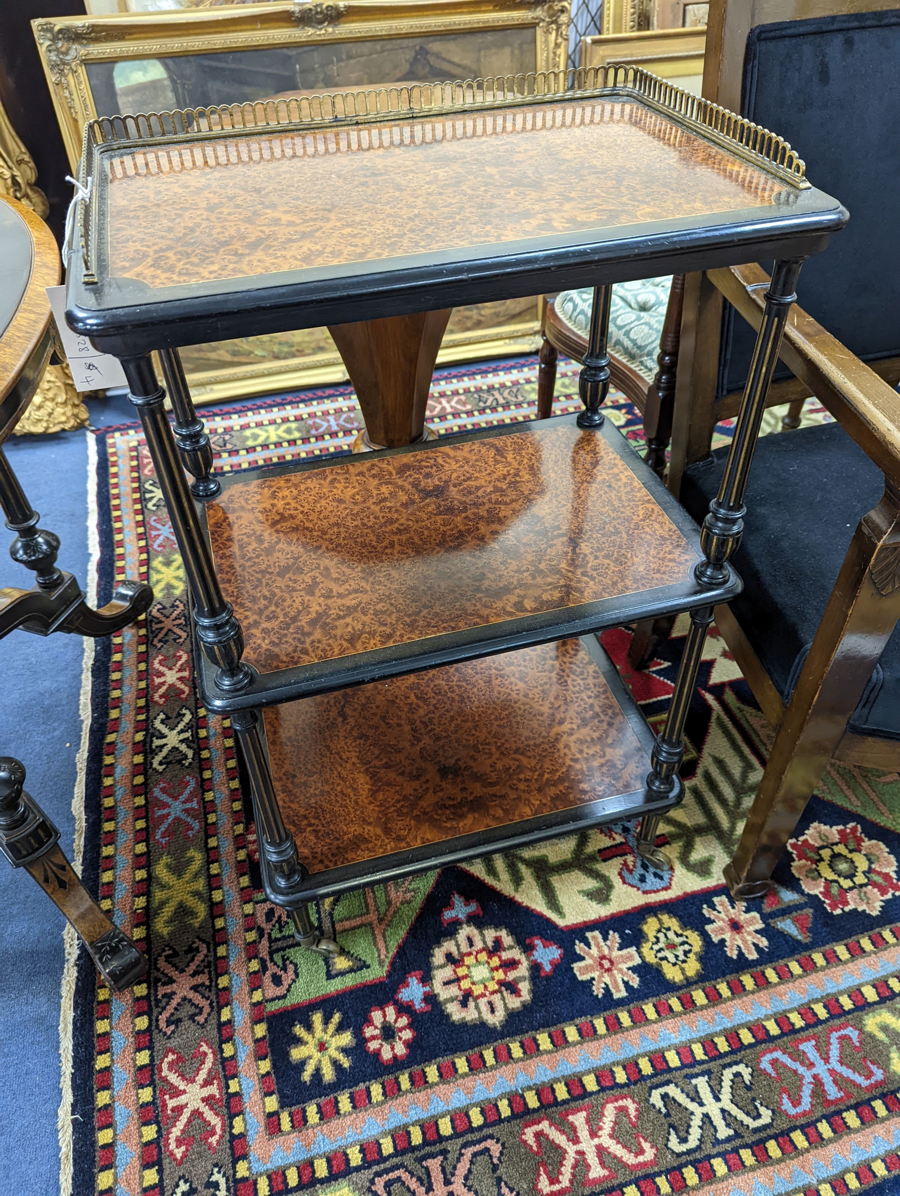 A late Victorian part ebonised Amboyna three tier whatnot with brass galleried top, width 49cm, depth 33cm, height 83cm